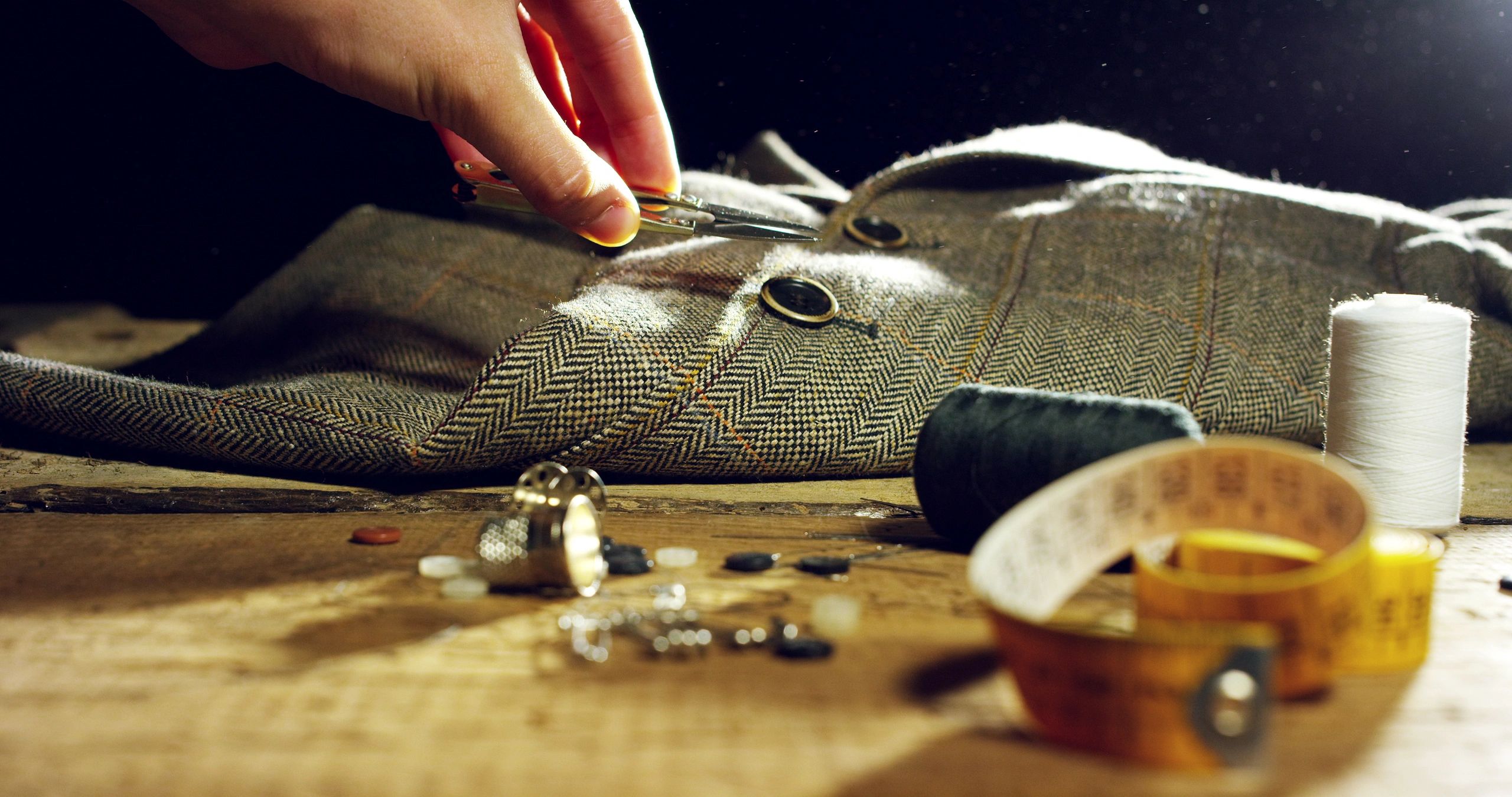 Close of a hand of a young tailor
