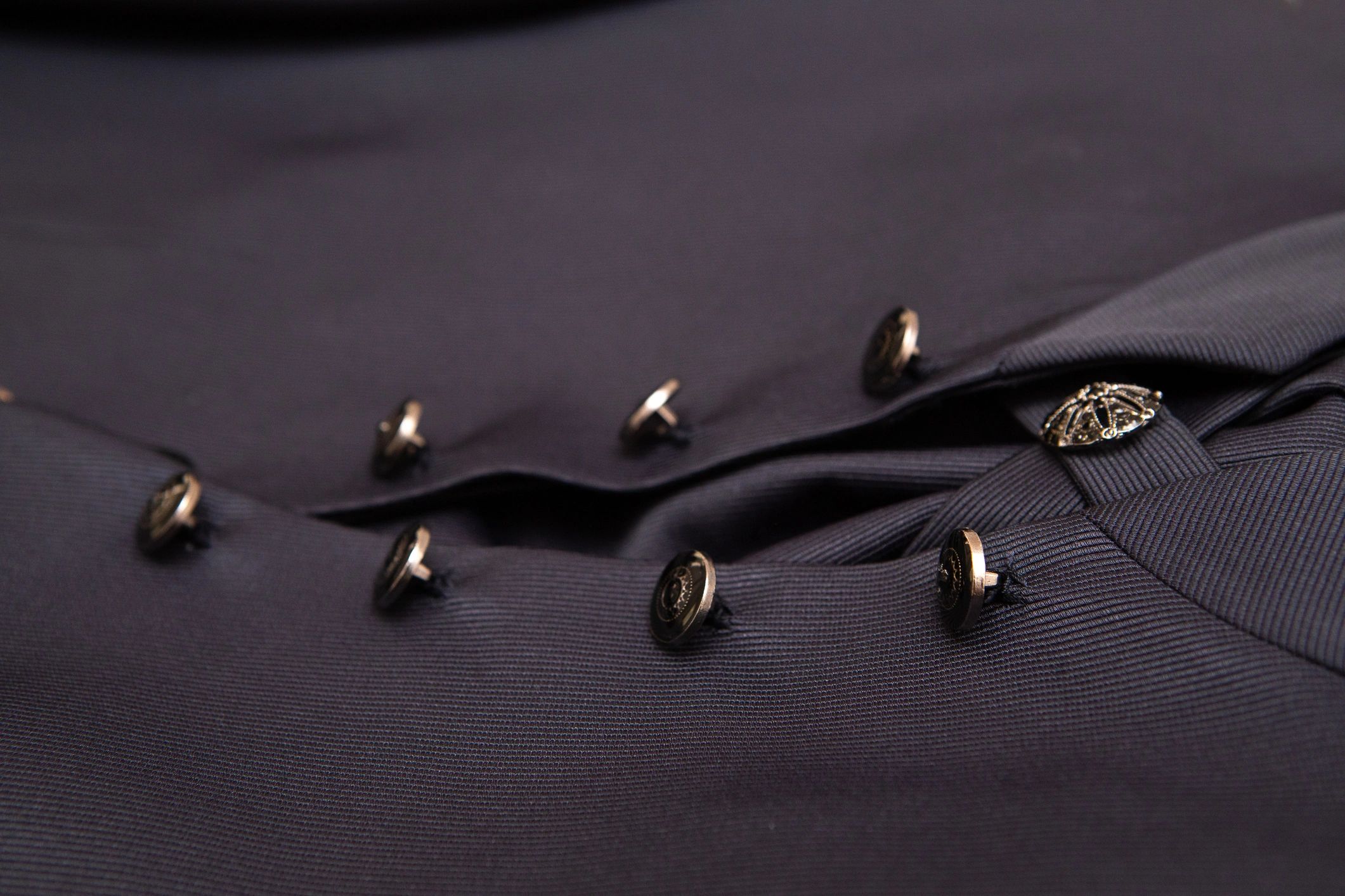 Close-up of a buttoned suit jacket with an